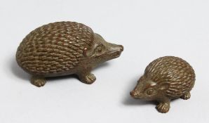 A SMALL PAIR OF JAPANESE BRONZE HEDGEHOGS.