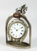 A JOCKEY CLOCK on a horseshoe and stirrup. 10ins high.