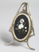 A GOOD SILVER PHOTOGRAPH FRAME with Pietra Dura panel, on a stand with an oval frame of a lady.