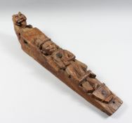 A SOUTH EAST ASIAN BEAST CARVING. 26ins long.