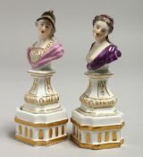 A GOOD SMALL PAIR OF MEISSEN PORCELAIN CLASSICAL BUSTS on gilt white pedestals. 11cm high, Cross