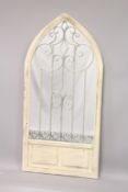 A WHITE GARDEN DOOR MIRROR. 4ft 4ins high, 2ft 2ins wide.