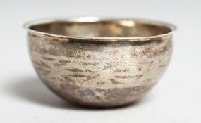 A TINY SCANDINAIAN SILVER BOWL. 1.75ins diameter.