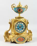 A VERY GOOD FRENCH BRONZE CLOCK with Sevres panels and urn finials. 12ins high.