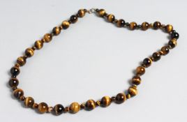 A TIGER'S EYE NECKLACE.