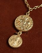 A 9CT GOLD PENDANT AND CHAIN.