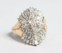 A 10CT GOLD BAGUETTE AND DIAMOND CLUSTER RING.