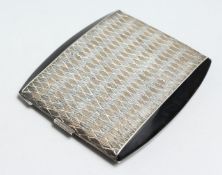 A SILVER AND BLACK ENAMEL CIGARETTE CASE. Alfred Dunhill.