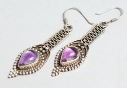 A PAIR OF SILVER AND AMETHYST DROP EARRINGS