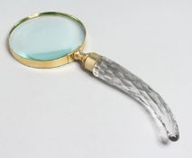 A MAGNIFYING GLASS with cut glass handle.