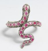 A SILVER, RUBY AND MARCASITE SNAKE BRACELET.