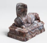 A SLAG GLASS SPINX. 4.5ins long.