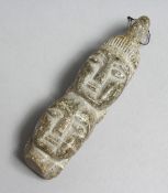 AN INTERESTING CARVED STONE DOUBLE HEAD. 3.75ins long.