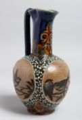 A GOOD DOULTON LAMBETH STONEWARE JUG painted with three panels of birds by Frank A. Butler with