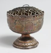 A SMALL INDIAN SILVER PEDESTAL BOWL. 3ins diameter.