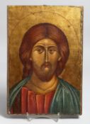 A PAINTED RUSSIAN ICON ON WOOD