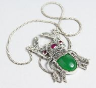 A SILVER RUBY SET SCARAB NECKLACE.