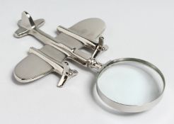 A NOVELTY CHROME PLANE MAGNIFYING GLASS.
