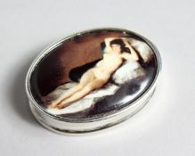 A SILVER OVAL SNUFF BOX the lid with a nude.