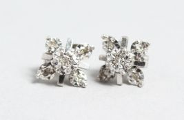 A PAIR OF 9CT GOLD FIVE STONE DIAMOND EARRINGS.