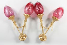 A GOOD PAIR OF BRONZE AND CRANBERRY GLASS WALL LIGHTS.
