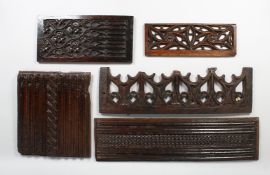 A SET OF FIVE 16TH - 17TH CENTURY CARVED AND PLATED OAK PANELS. 25ins x 7.5ins, 27ins x 7ins,