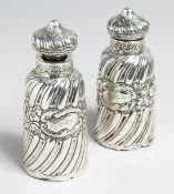 A PAIR OF SILVER SCENT BOTTLES AND STOPPERS.