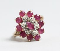 A 9CT GOLD RUBY AND DIAMOND RING.