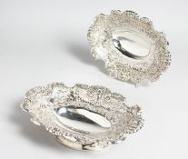 A PAIR OF EDWARD VII OVAL REPOUSSE DISHES. London 1907. Maker Richard & William Serley. Weight