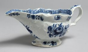 AN 18TH CENTURY BOW SAUCE BOAT painted with a large rose and other flowers with an inner cell