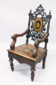 A GOOD 19TH CENTURY BLACK FOREST CARVED AND INLAID MUSICAL CHAIR