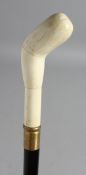 A WALKING STICK with carved bone handle.