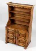 A GOOD MINIATURE PINE DRESSER, 19th Century, with a double rack over a pair of panelled doors. 20ins