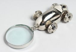 A NOVELTY CHROME CAR MAGNIFYING GLASS.