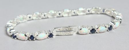 A SILVER, OPAL AND SAPPHIRE LINE BRACELET.