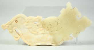 A CHINESE CARVED NEPHRITE JADE ARCHAIC AMULET, 15cm long.