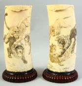 A PAIR OF EARLY 20TH CENTURY JAPANESE IVORY TUSK VASES, depicting fighting lions and tigers, mounted