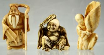 THREE JAPANESE CARVED IVORY NETSUKES, including a sage, a hotei and a man holding a giant