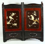 A JAPANESE HARDWOOD TWO PANEL FOLDING SCREEN, with onlaid ivory relief decoration depicting bir