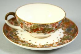 A SMALL JAPANESE SATSUMA CUP AND SAUCER, finely decorated with flowers and butterflies, each piece