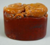 A CHINESE CARVED HARDSTONE BLANK SEAL, the top carved with chilong / dragon, in a fitted box, 4.