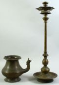 A LARGE 18TH CENTURY INDIAN BRASS OIL LAMP, together with a brass ewer, (2).