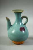 A CHINESE JUN STYLE GLAZED POTTERY EWER, 17cm high.