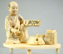 A JAPANESE CARVED IVORY OKIMONO of a seated calligraphy artist, mounted to raised ivory base, the