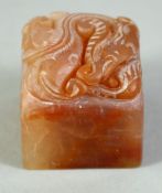 A SMALL CHINESE CARVED HARDSTONE BLANK SEAL, the top carved with chilong, in a fitted box.