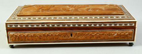 AN INDIAN SANDALWOOD AND BONE INLAID RECTANGULAR LIDDED BOX, the hinged lid with carved panel to the