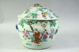 A CHINESE FAMILLE ROSE PORCELAIN JAR AND COVER, painted with various figures in an outdoor