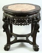 A CHINESE MARBLE INSET HARDWOOD STAND, with carved and pierced frieze, on four curving legs united