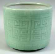 A LARGE CHINESE CELADON GLAZE PORCELAIN BRUSH POT, the exterior with incised greek key decoration,
