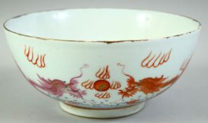 A CHINESE CORAL RED AND WHITE PORCELAIN DRAGON BOWL, the exterior with dragons and the flaming pearl